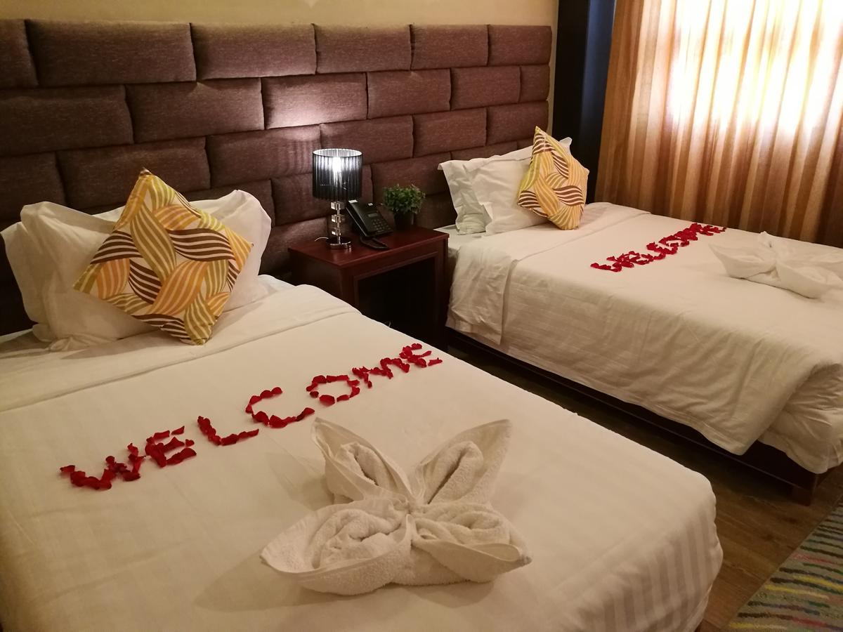 Great Wall Hotel Dar es Salaam Quarto foto
